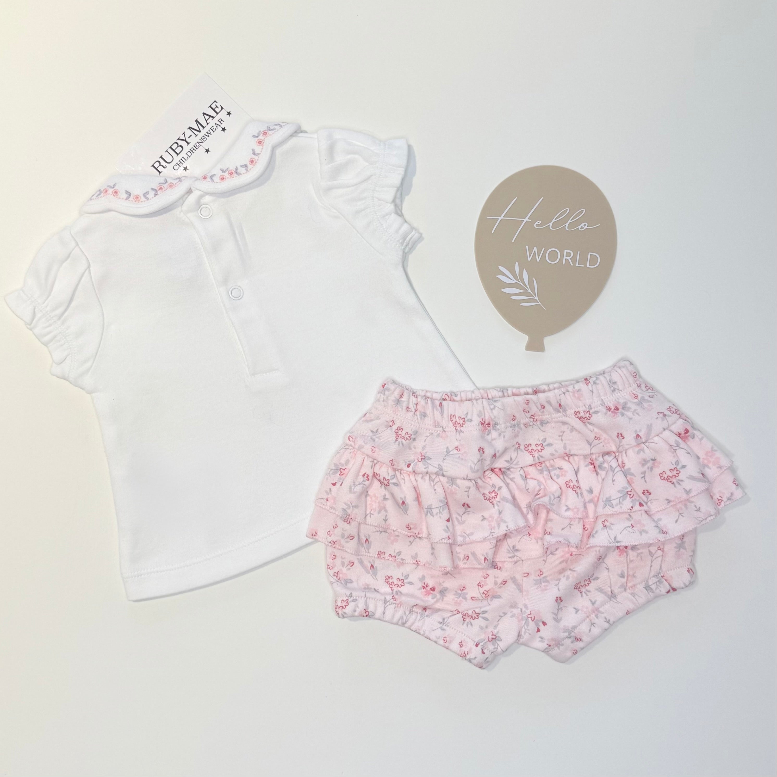 
                  
                    Pink Floral Frill Shorts With Matching White Flower Top Outfit - Lyla
                  
                