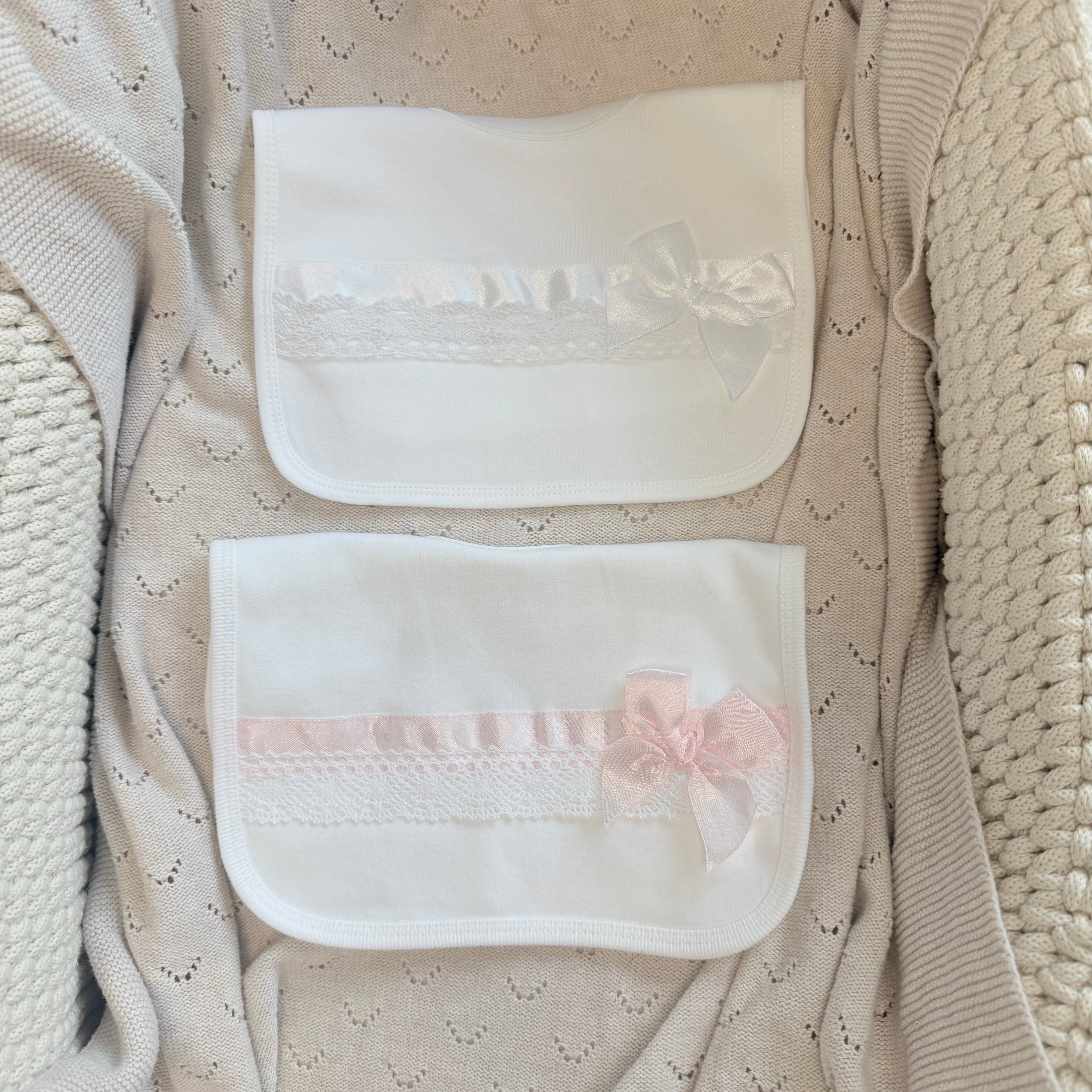 
                  
                    Baby Girls White Bib With Pink Satin Bow & Lace Trim
                  
                