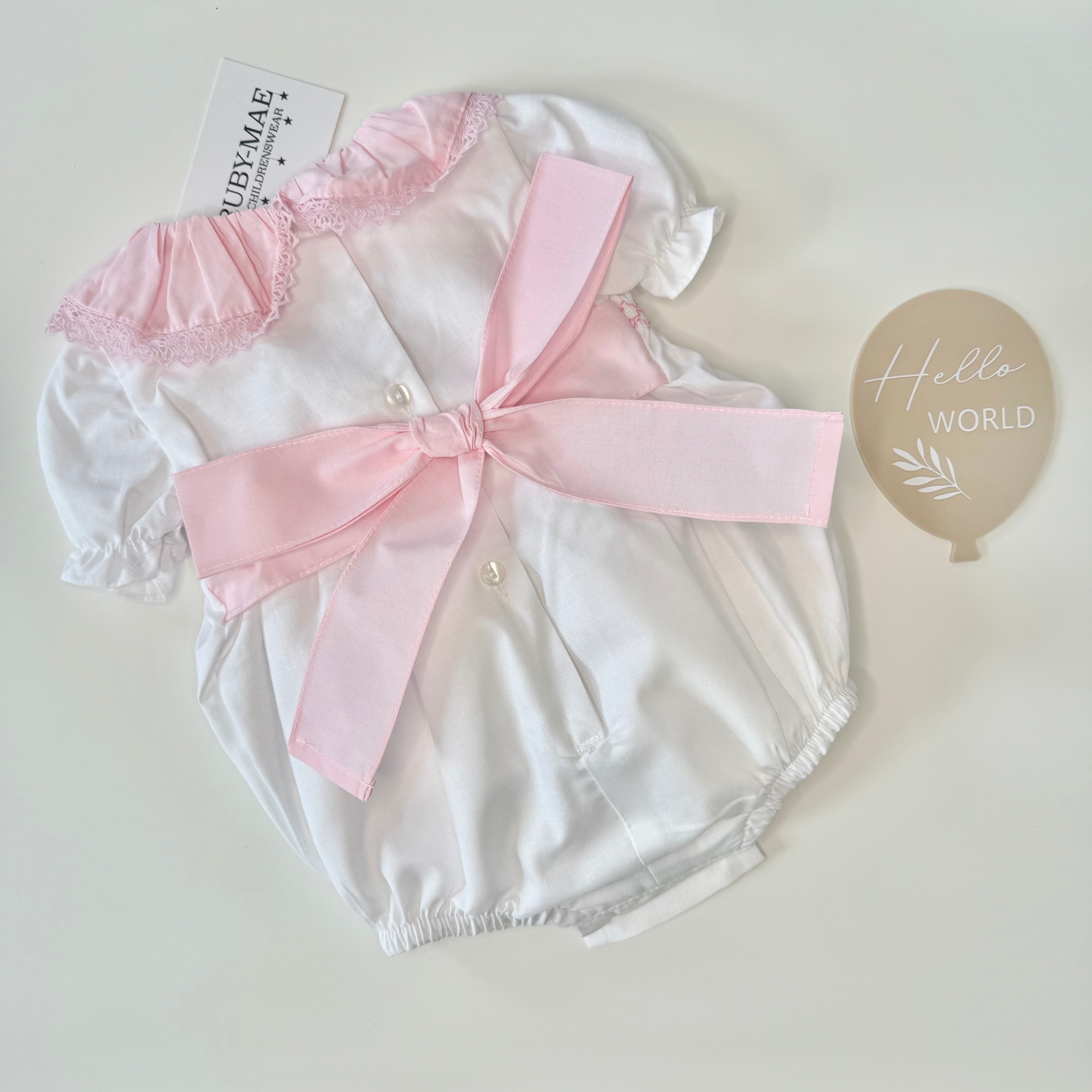 
                  
                    White With Pink Smock Bow Romper - Millie
                  
                