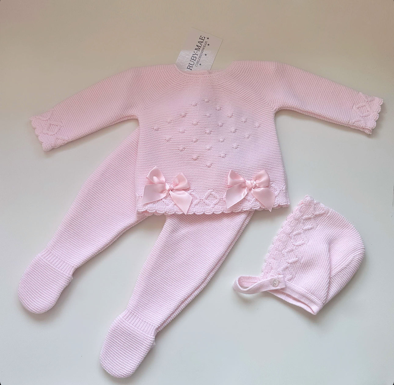 
                  
                    Baby Pink Bow Knitted Jumper And Pants Outfit With Matching Hat - Elisha
                  
                