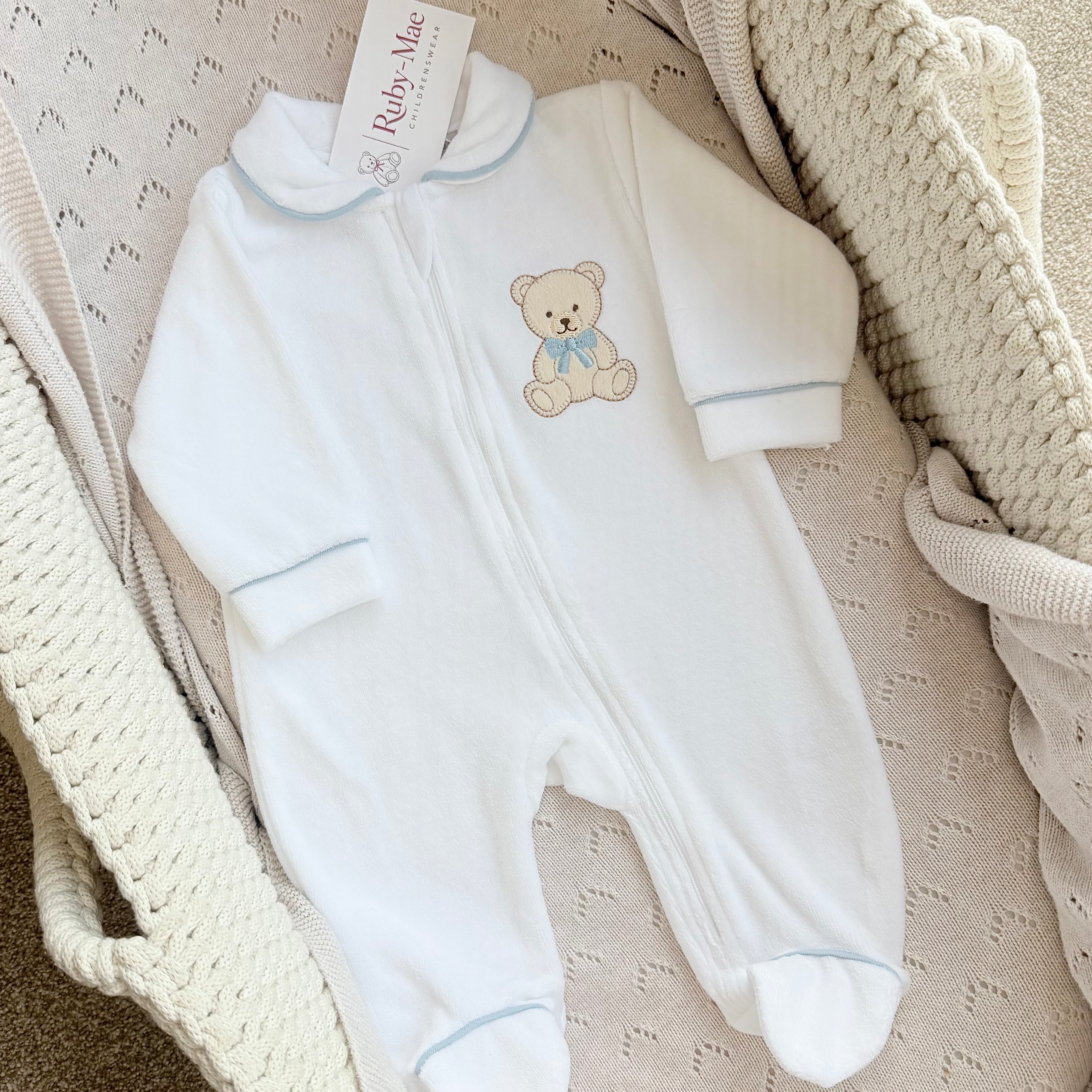 
                  
                    White Velour Baby Teddy Bear Sleepsuit – Pink & Blue
                  
                